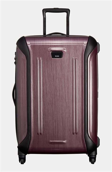 tripp hard shell medium suitcase.